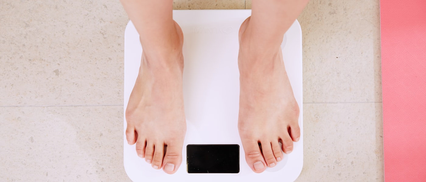 Person stepping on a scale — what your BMI numbers mean